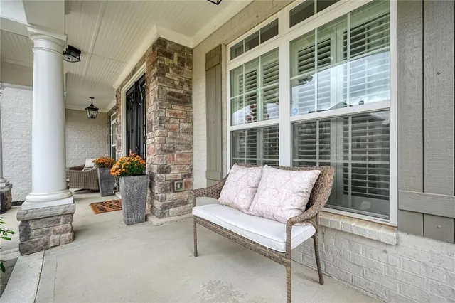 a living room with furniture a rug and a window