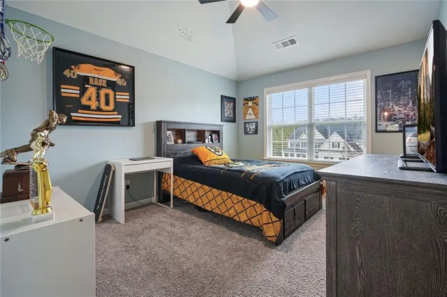 a balcony with wooden floor table and chairs