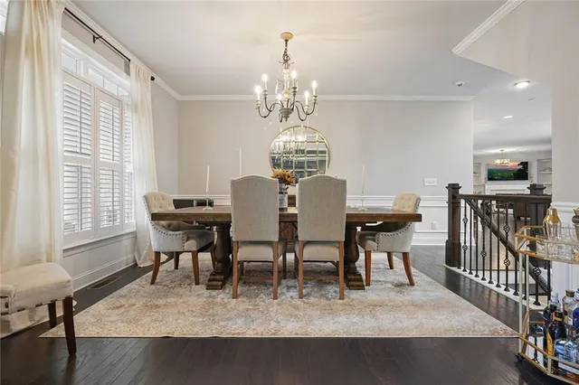 a living room with fireplace furniture and a floor to ceiling window