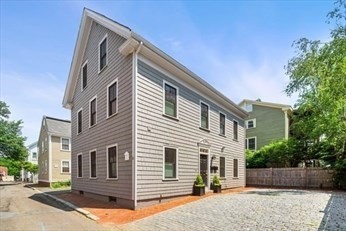 a view of a house with a street
