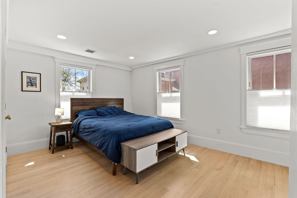 23 Union Street, Unit 2 Salem, MA 01970 - Photo 18 of 33 a spacious bedroom with a bed and window