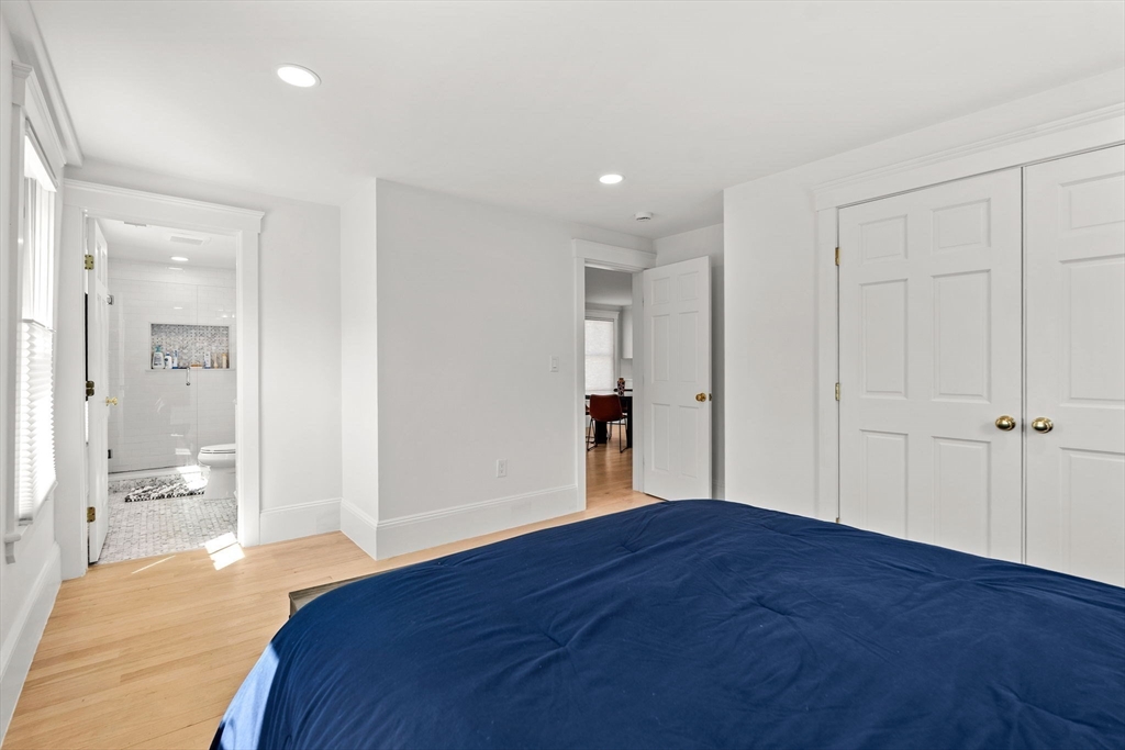 23 Union Street, Unit 2 Salem, MA 01970 - Photo 19 of 33 a view of an empty room with wooden floor and a bathroom