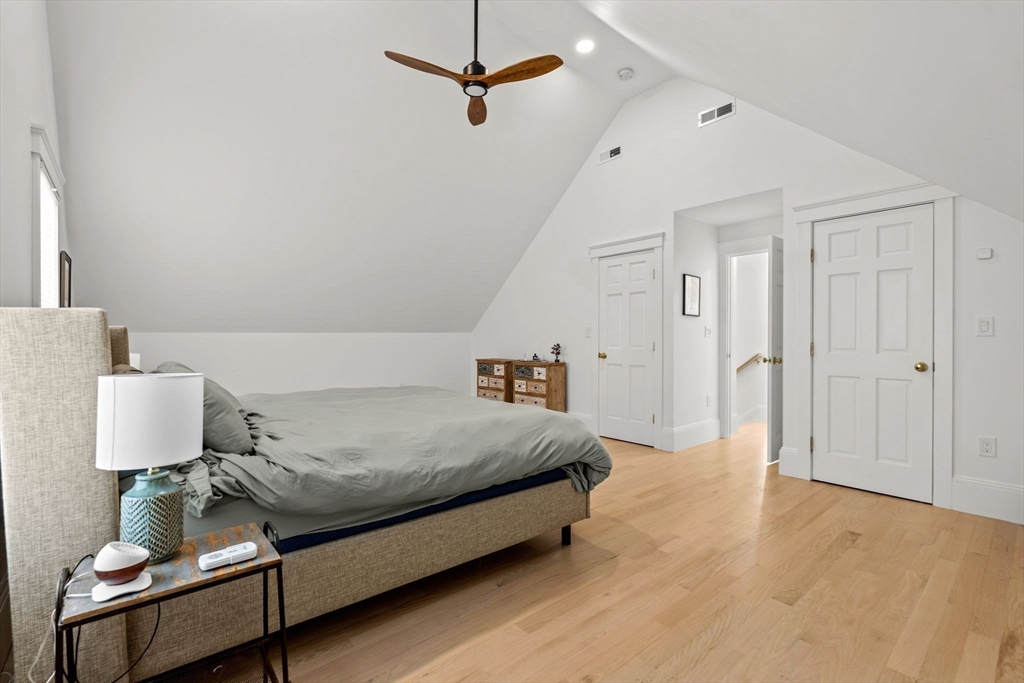 23 Union Street, Unit 2 Salem, MA 01970 - Photo 27 of 33 a spacious bedroom with a bed and a lamp