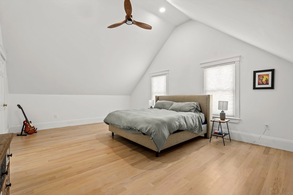 23 Union Street, Unit 2 Salem, MA 01970 - Photo 28 of 33 a bedroom with a bed and wooden floor