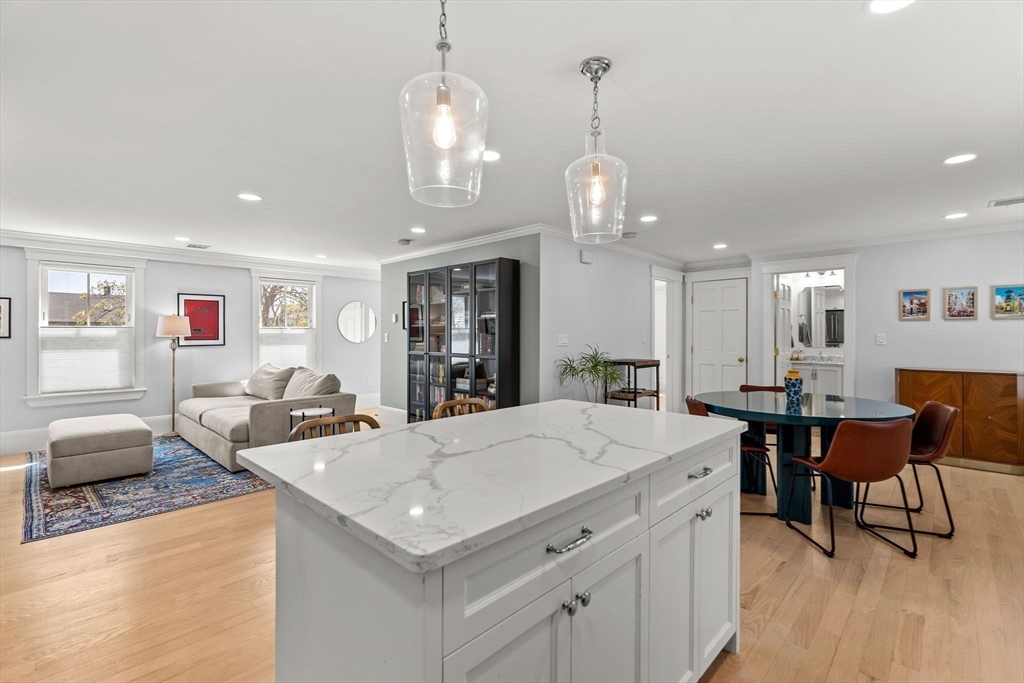 23 Union Street, Unit 2 Salem, MA 01970 - Photo 4 of 33 a large kitchen with a table and chairs