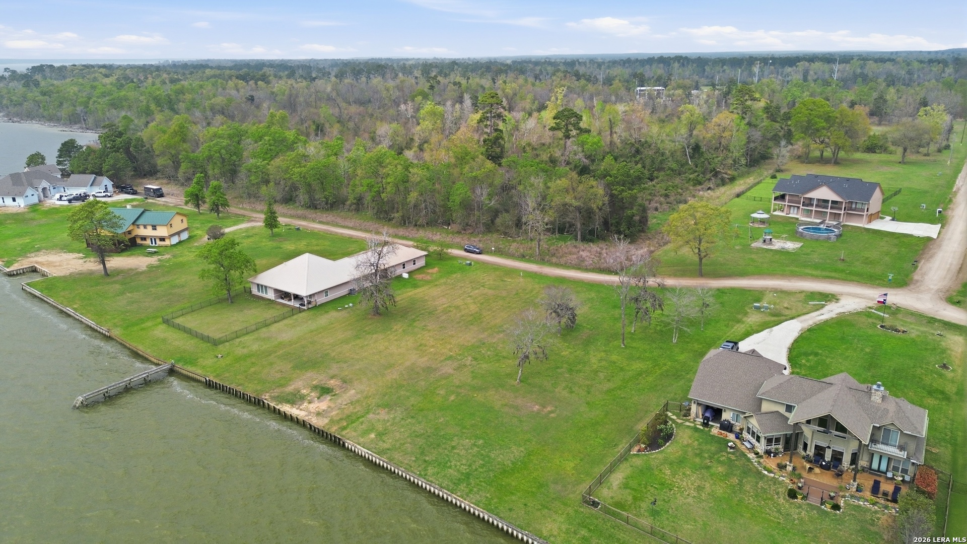 Tbd Bridgewater Onalaska, TX 77360 - Photo 4 of 15 a view of a lake with a yard