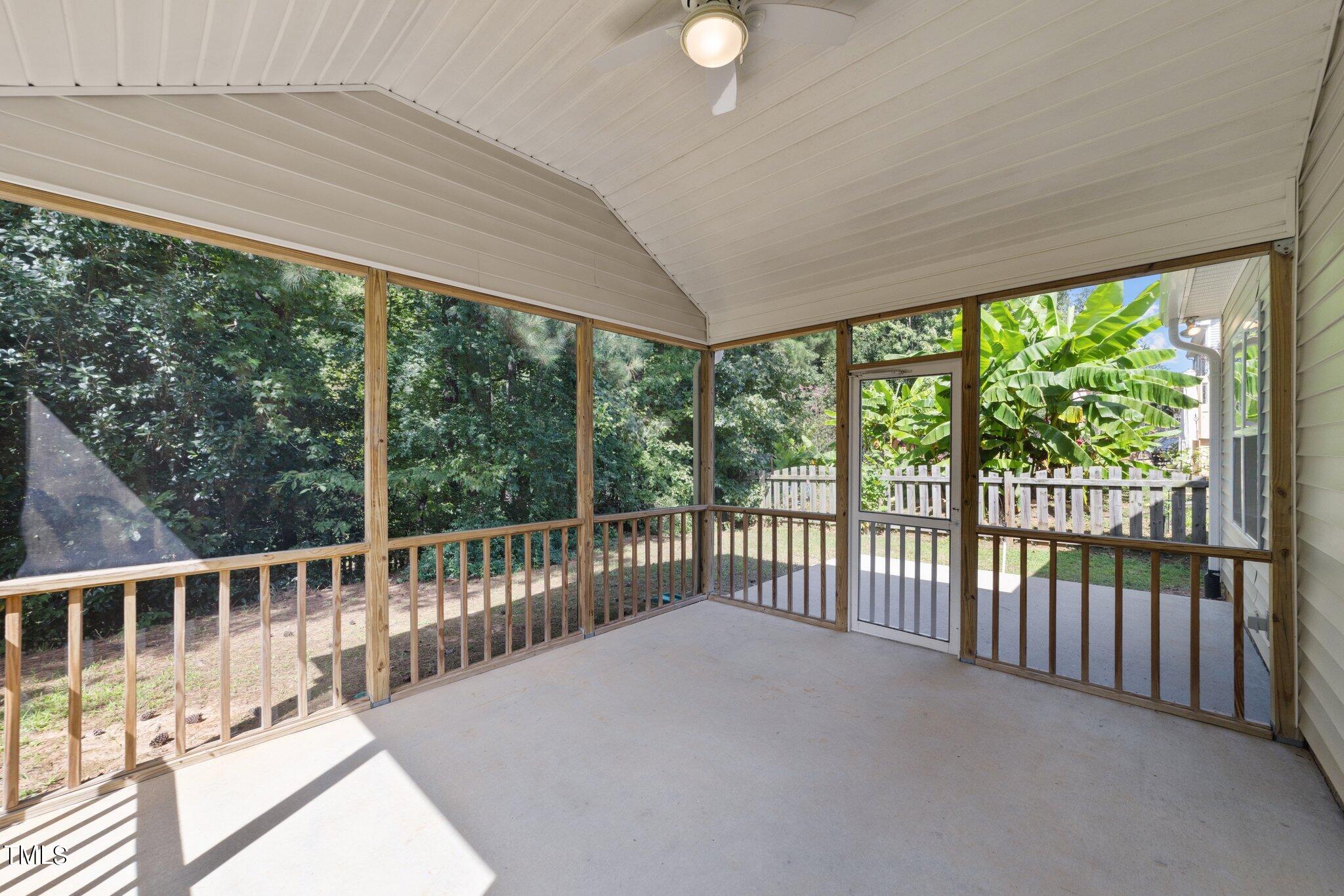 6900 Rex Road Holly Springs, NC 27540 - Photo 12 of 43 Screened-in porch with adjoining patio pad for grill just off kitchen