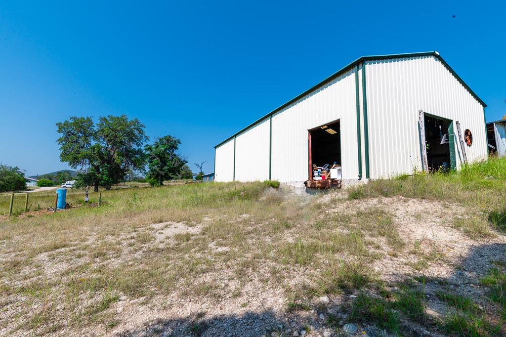 17839 Highway 16 Medina, TX 78055 - Photo 7 of 8 a backyard of a house with table and chairs