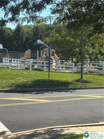 a view of swimming pool and trees in the background