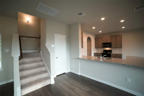 a view of a hallway with seating area