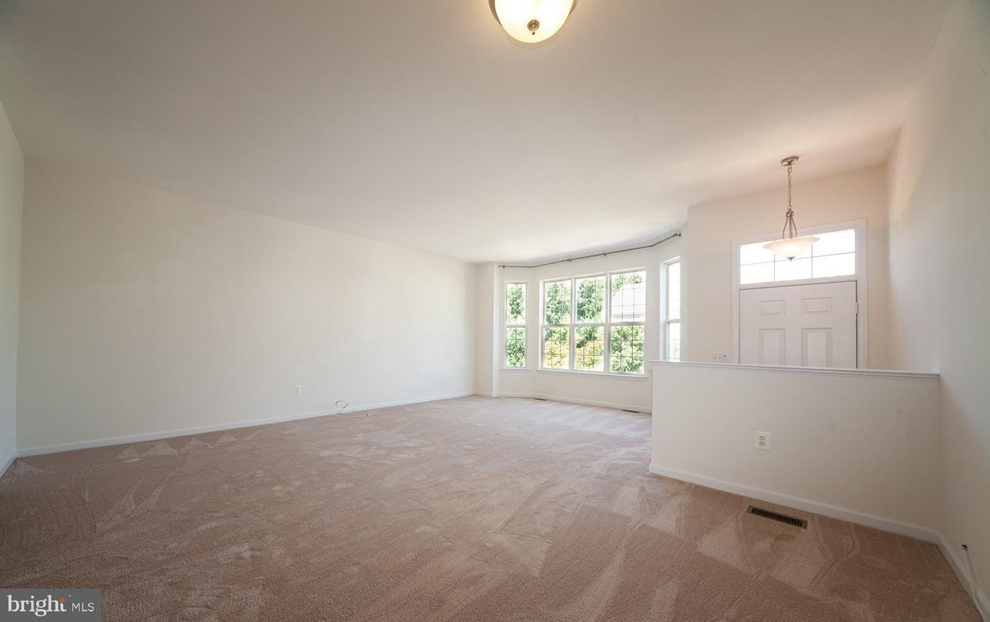 6727 Sullivan Way Alexandria, VA 22315 - Photo 4 of 24 an empty room with windows