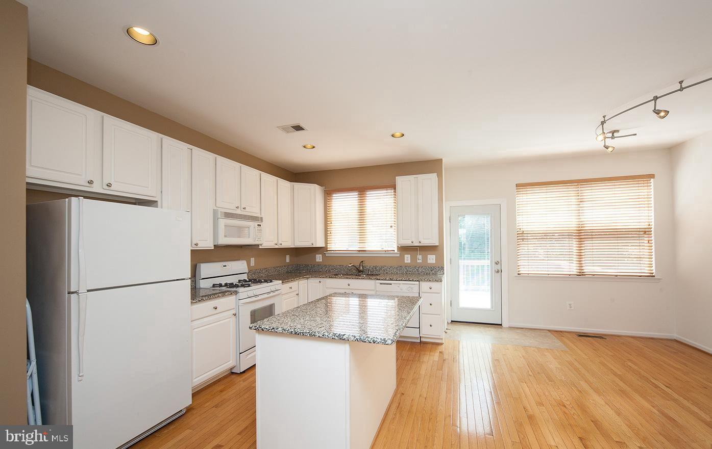 6727 Sullivan Way Alexandria, VA 22315 - Photo 9 of 24 a kitchen that has a sink a refrigerator and window
