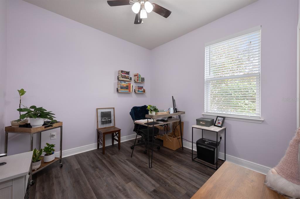 1398 Riley Circle Deland, FL 32724 - Photo 13 of 29 a view of a workspace with furniture and a window
