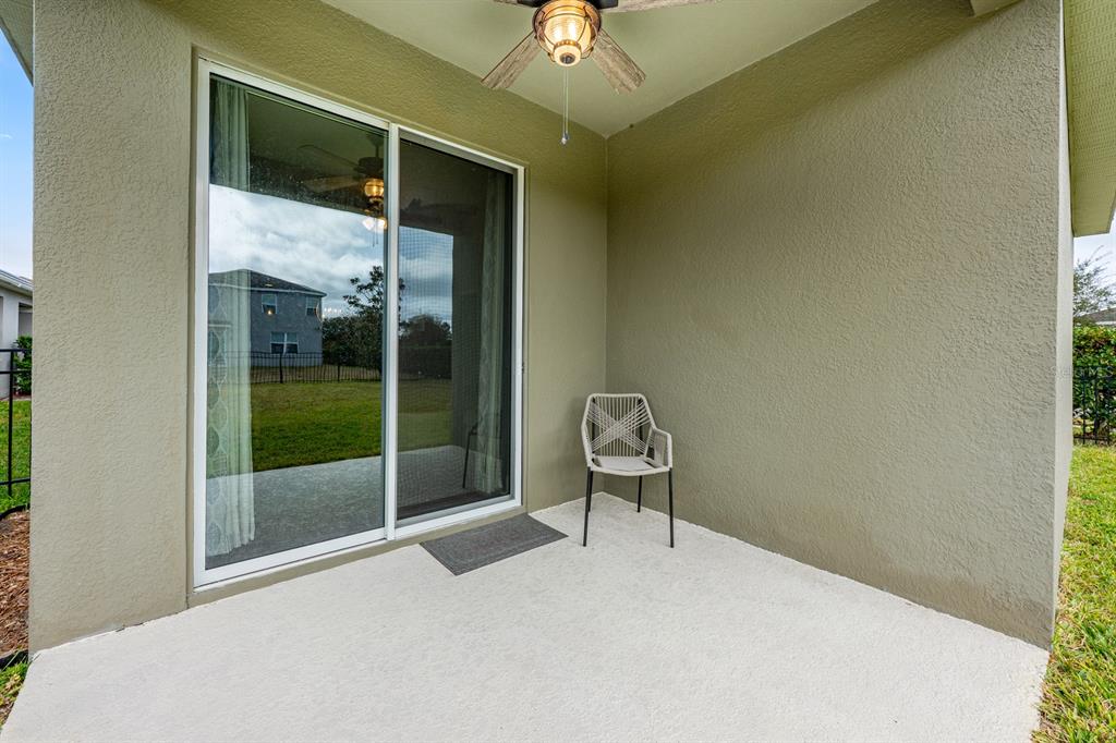 1398 Riley Circle Deland, FL 32724 - Photo 15 of 29 a bedroom with a bed and a chandelier