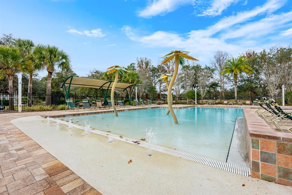 1398 Riley Circle Deland, FL 32724 - Photo 19 of 29 a view of a swimming pool with a lake