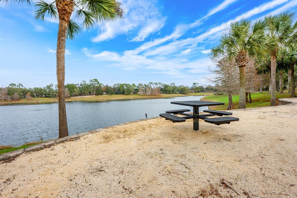 1398 Riley Circle Deland, FL 32724 - Photo 29 of 29 a park view with a bench under an umbrella