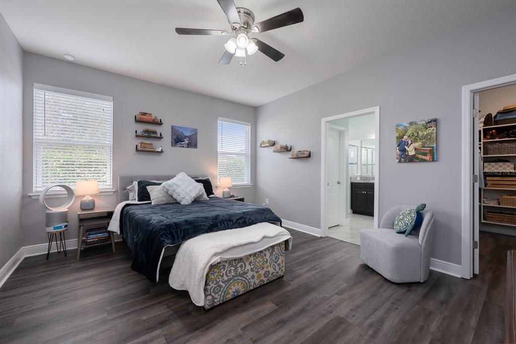 1398 Riley Circle Deland, FL 32724 - Photo 8 of 29 a bedroom with a bed and wooden floor