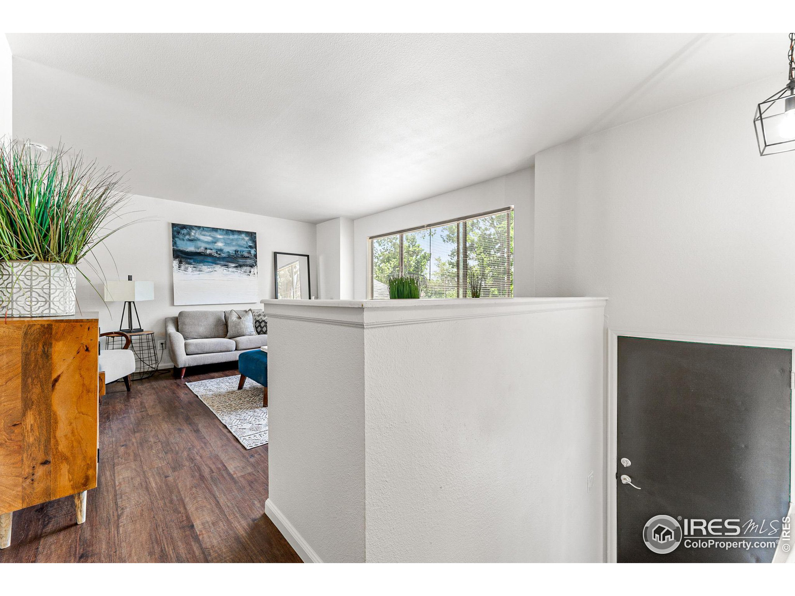 2408 Orchard Place Fort Collins, CO 80521 - Photo 15 of 36 a living room with furniture and a table