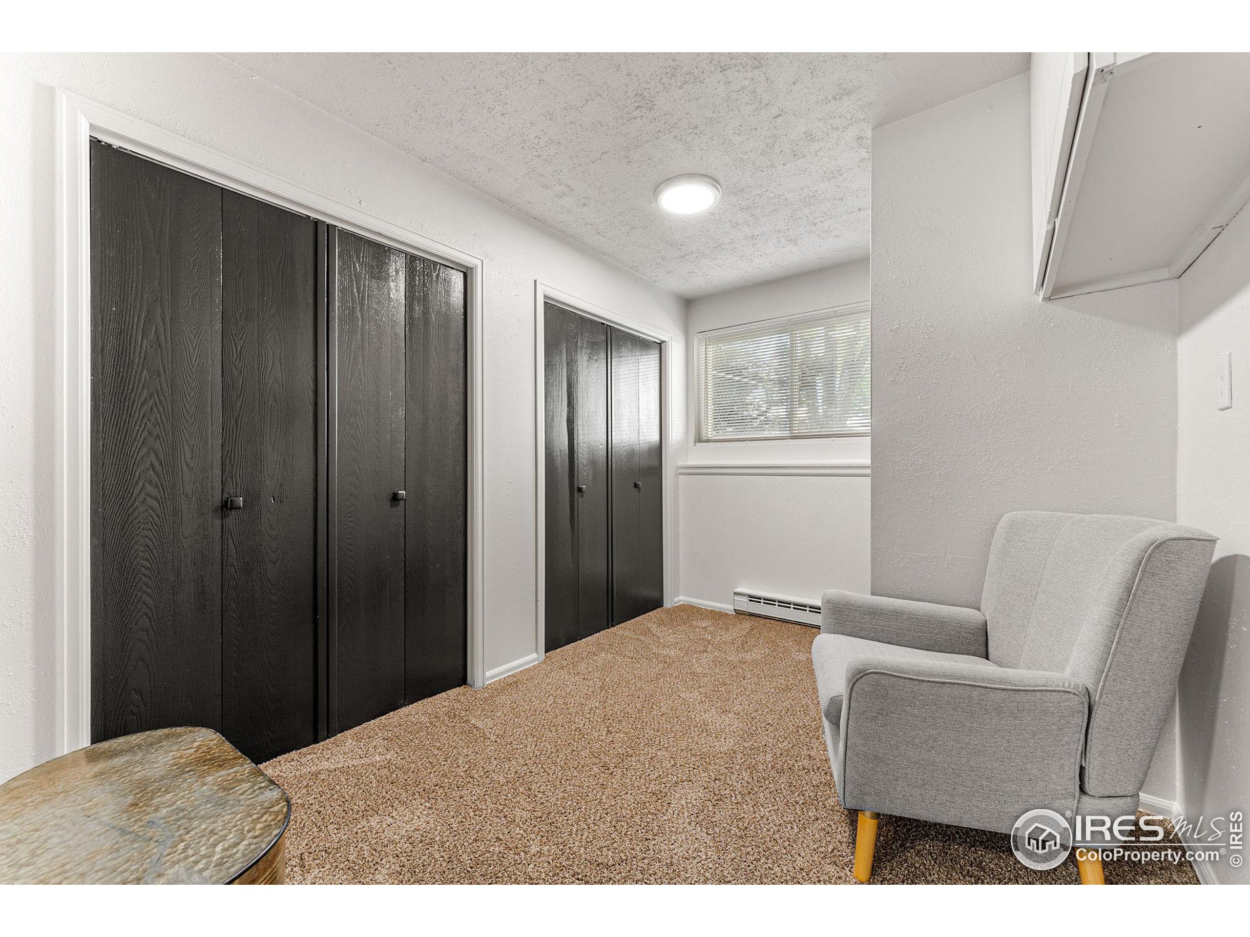 2408 Orchard Place Fort Collins, CO 80521 - Photo 27 of 36 a bedroom with a bed and furniture