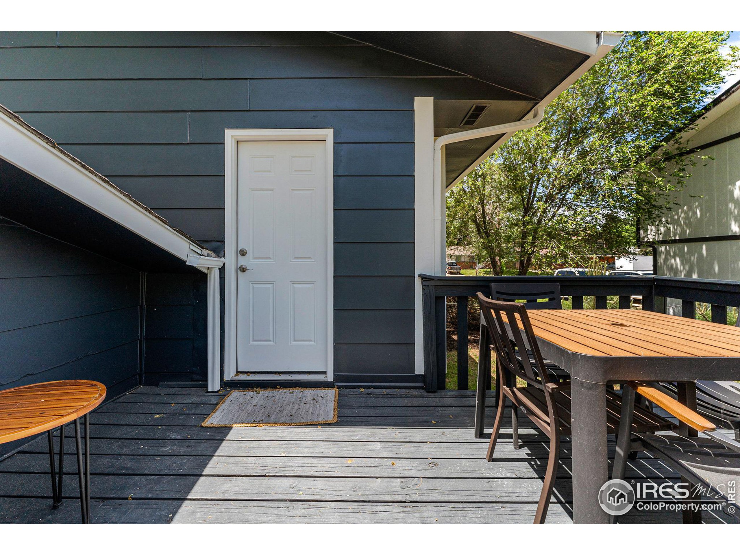 2408 Orchard Place Fort Collins, CO 80521 - Photo 30 of 36 a backyard of a house with table and chairs