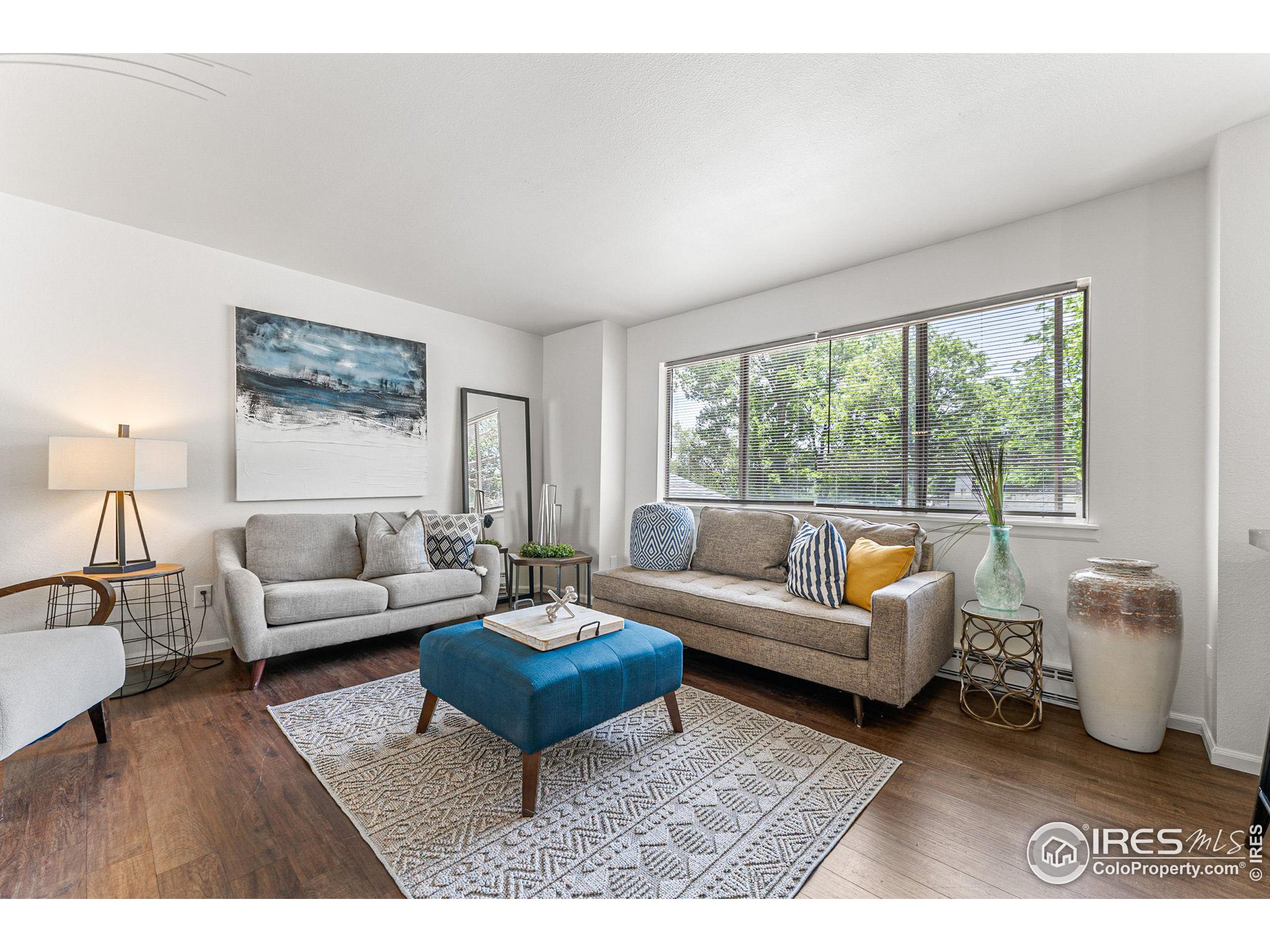 2408 Orchard Place Fort Collins, CO 80521 - Photo 3 of 36 a living room with furniture and a large window