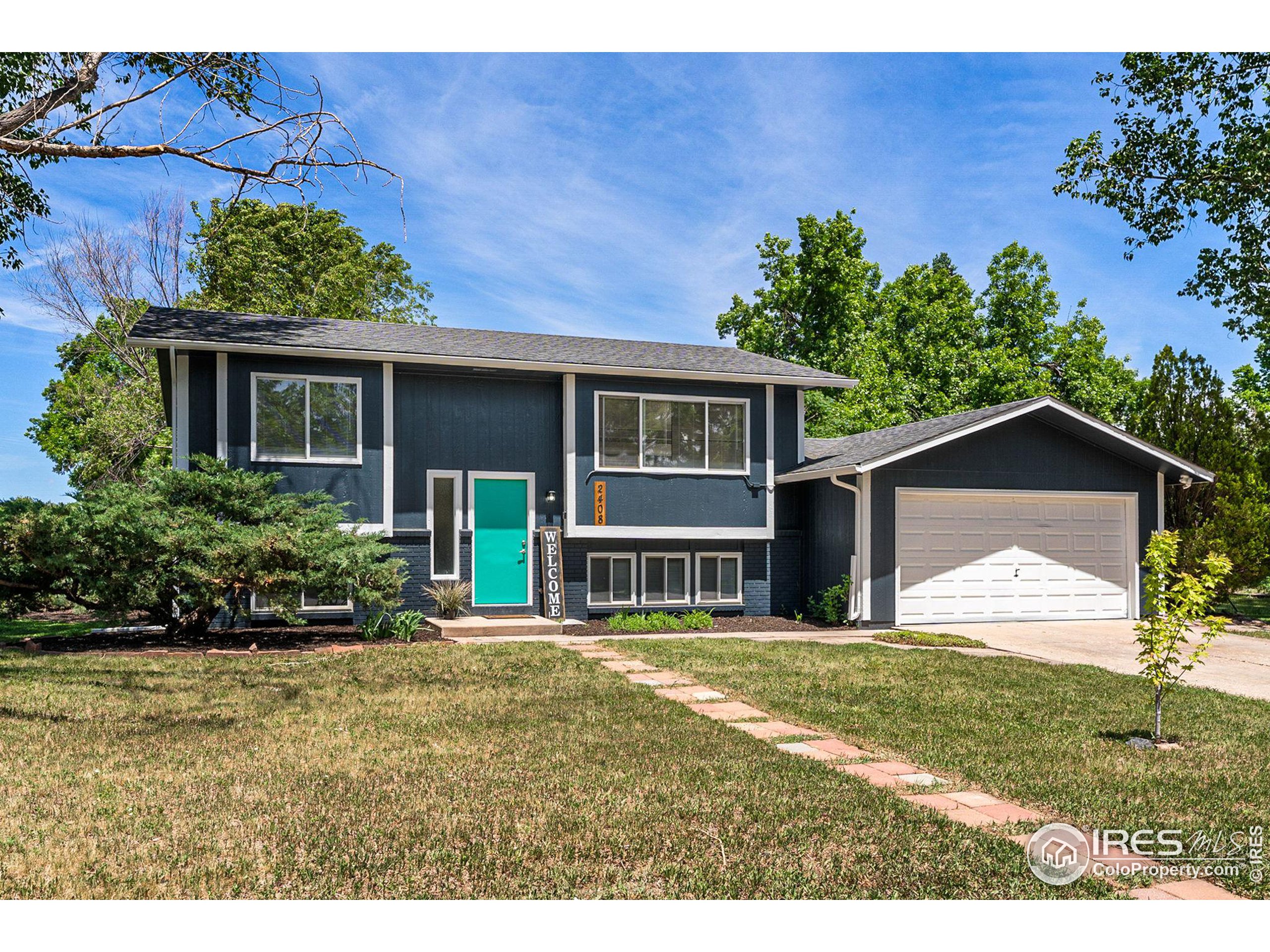 2408 Orchard Place Fort Collins, CO 80521 - Photo 34 of 36 a front view of a house with a yard
