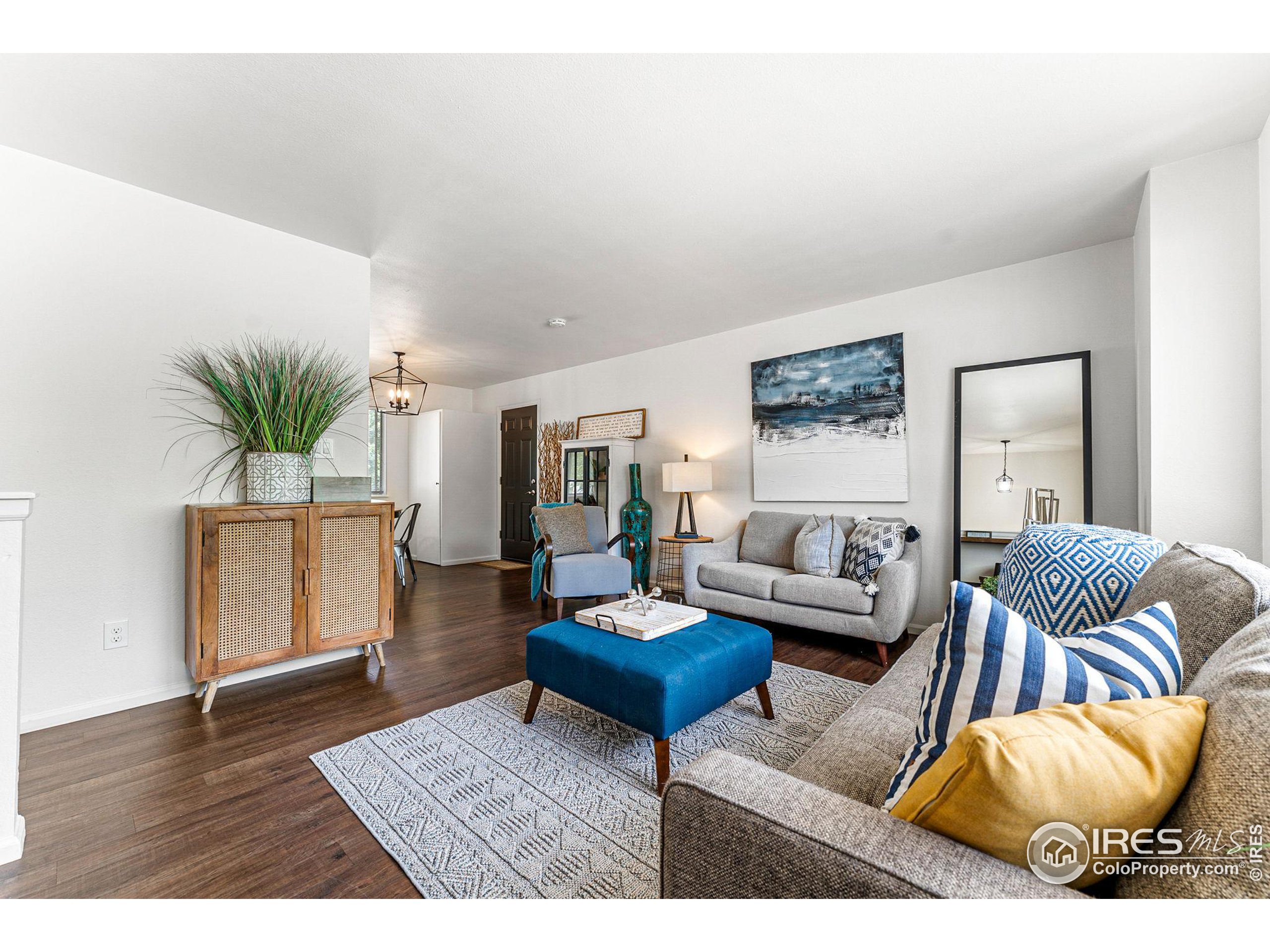 2408 Orchard Place Fort Collins, CO 80521 - Photo 4 of 36 a living room with furniture and a potted plant