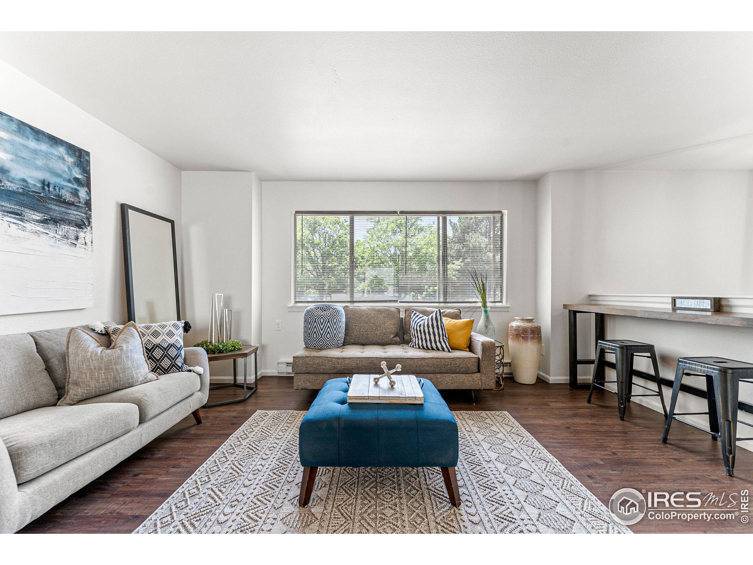 2408 Orchard Place Fort Collins, CO 80521 - Photo 5 of 36 a living room with furniture and a large window