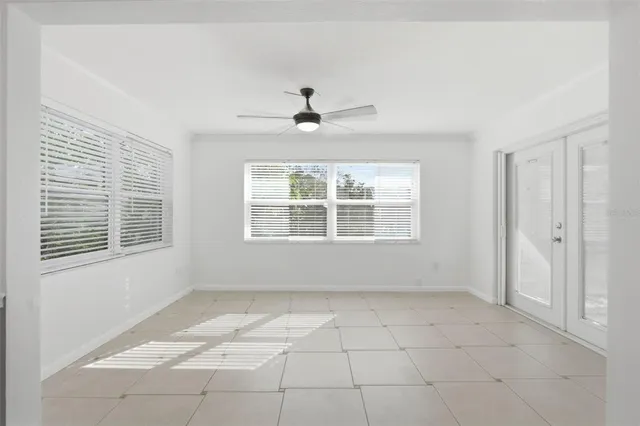 a view of an empty room with a window