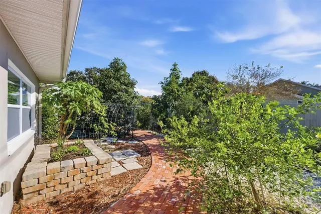 a backyard of a house with lots of green space