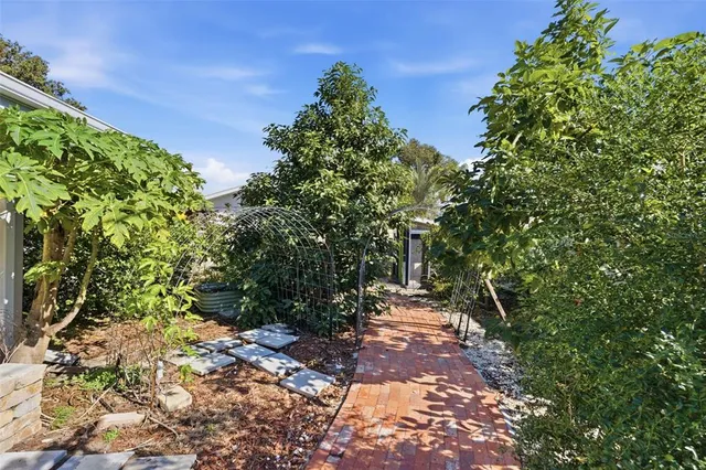 a backyard of a house with lots of green space