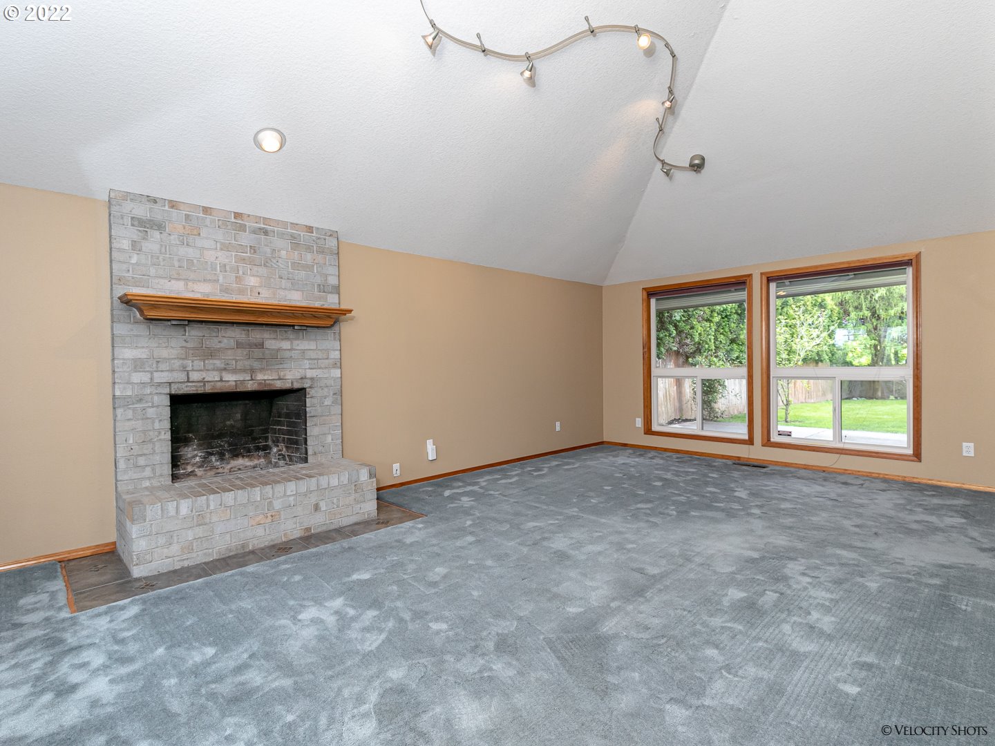 3005 Northeast 166th Way Ridgefield, WA 98642 - Photo 5 of 32 a view of an empty room with a fireplace and a window