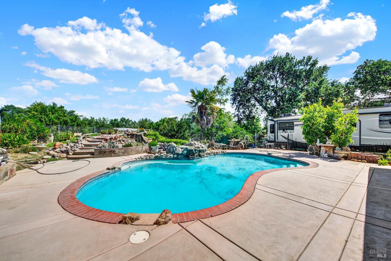 4851 Udell Road Vacaville, CA 95688 - Photo 30 of 65 a view of a swimming pool with a patio