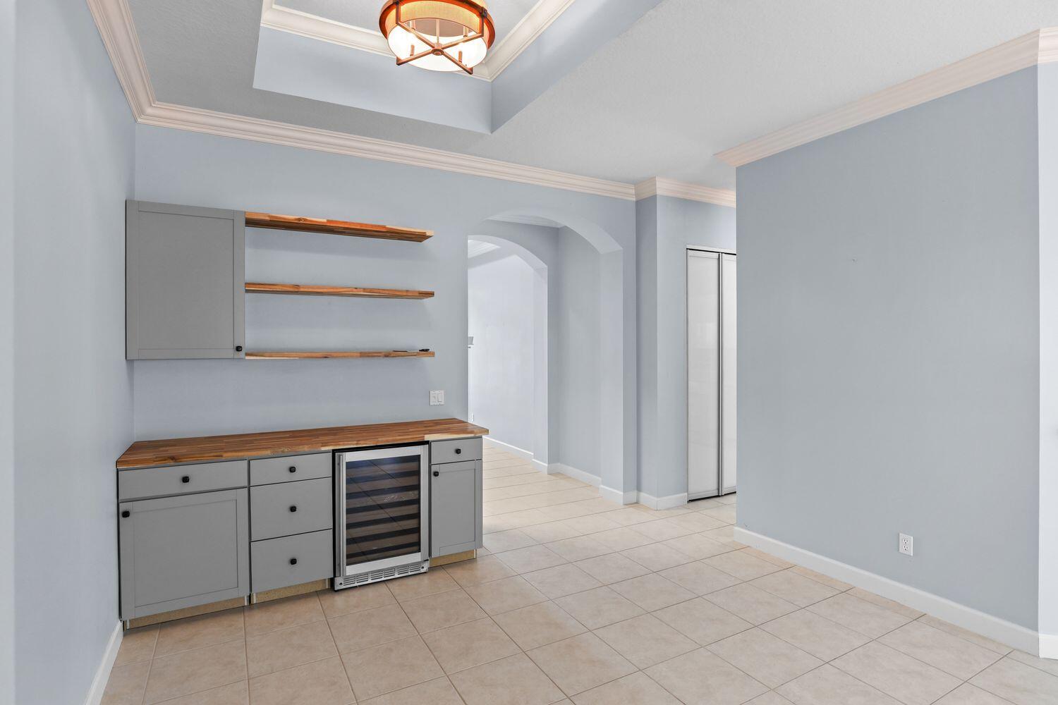 9152 Short Chip Circle Port St. Lucie, FL 34986 - Photo 19 of 72 a view of cabinets and wooden floor