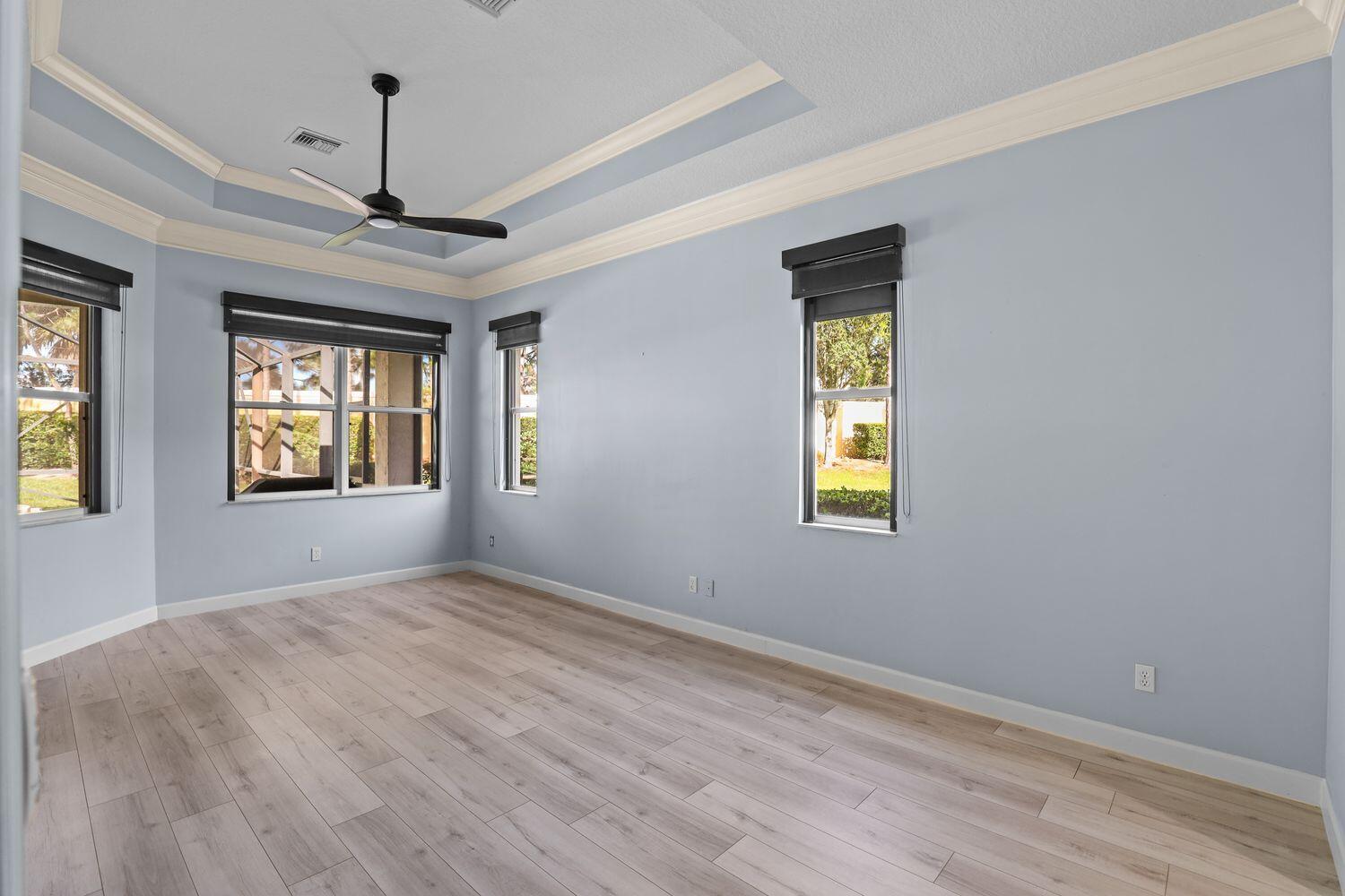 9152 Short Chip Circle Port St. Lucie, FL 34986 - Photo 21 of 72 a view of an empty room with window and wooden floor