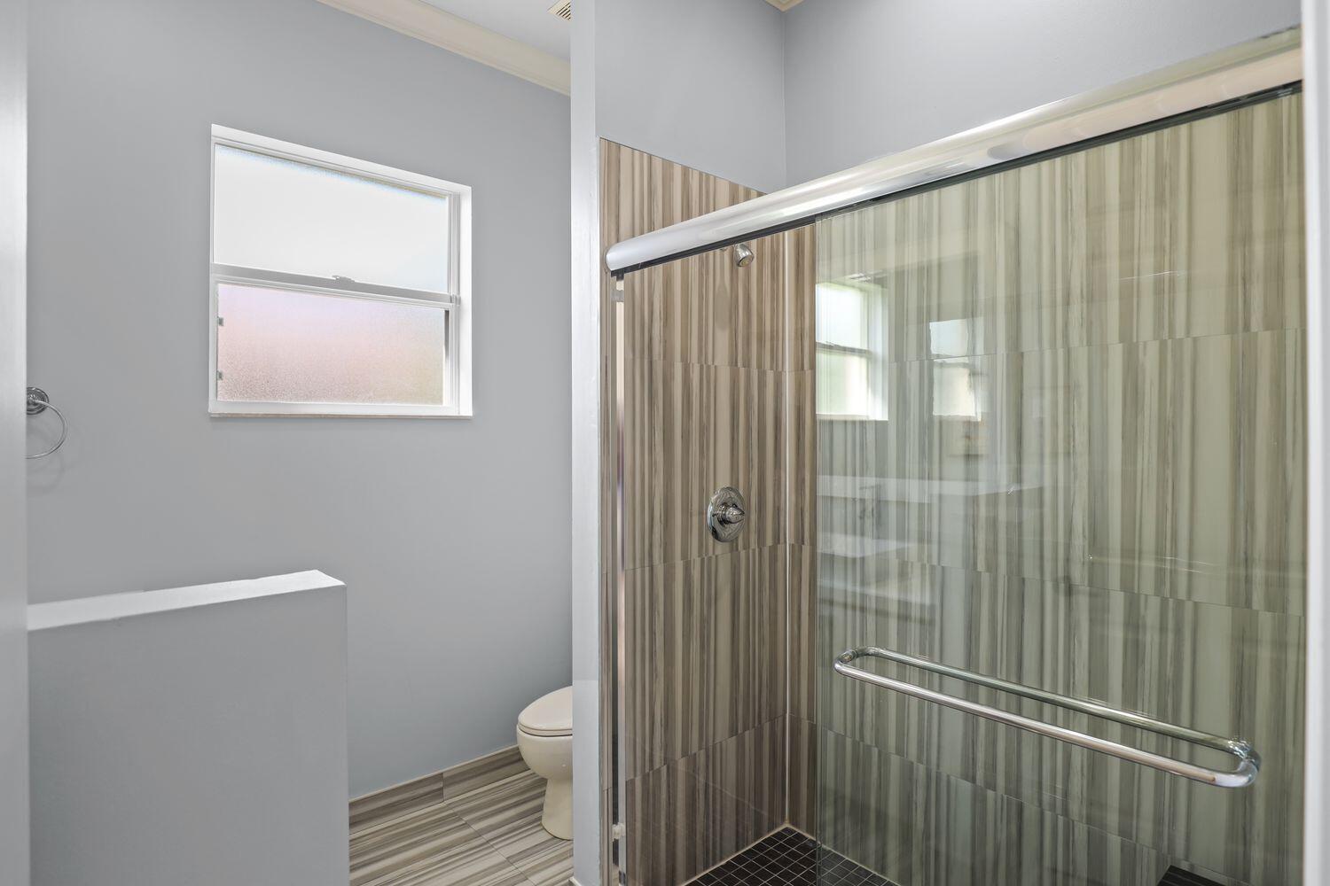 9152 Short Chip Circle Port St. Lucie, FL 34986 - Photo 29 of 72 a bathroom with a shower