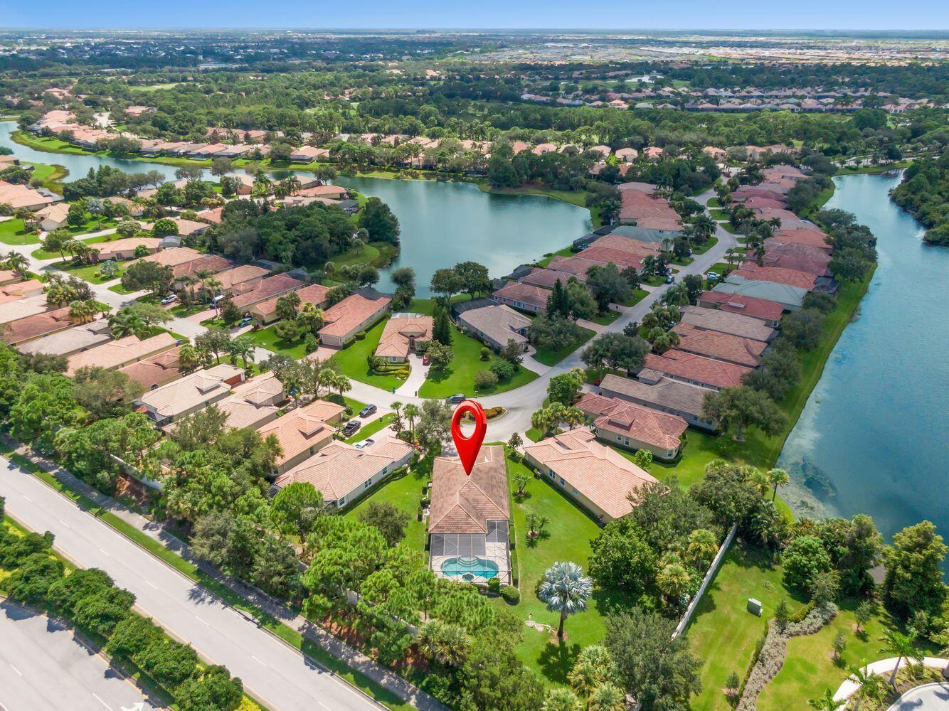 9152 Short Chip Circle Port St. Lucie, FL 34986 - Photo 3 of 72 an aerial view of residential houses with outdoor space and river