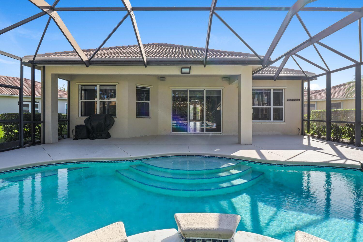 9152 Short Chip Circle Port St. Lucie, FL 34986 - Photo 35 of 72 a view of a house with backyard porch and sitting area