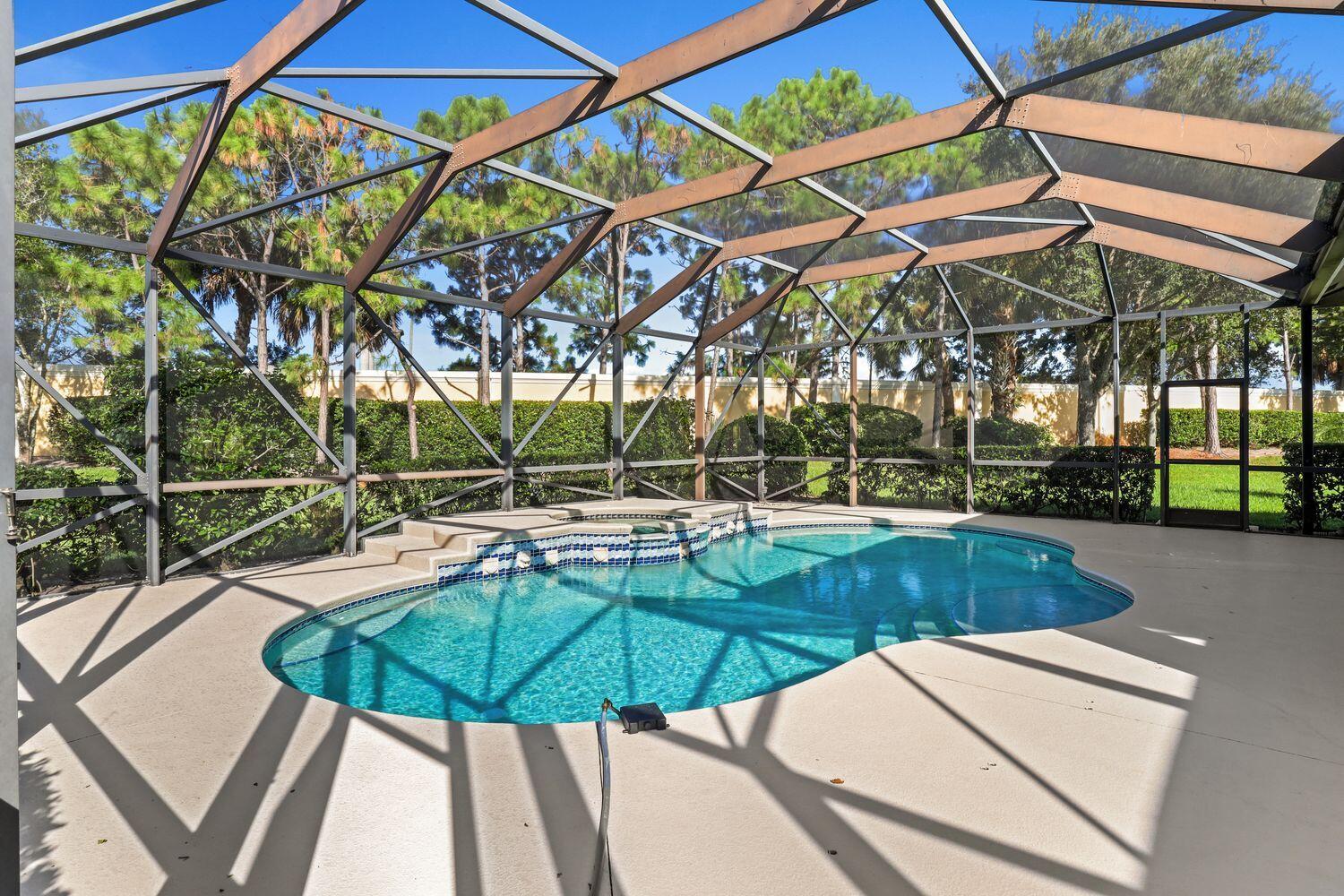 9152 Short Chip Circle Port St. Lucie, FL 34986 - Photo 37 of 72 a view of a swimming pool with a patio