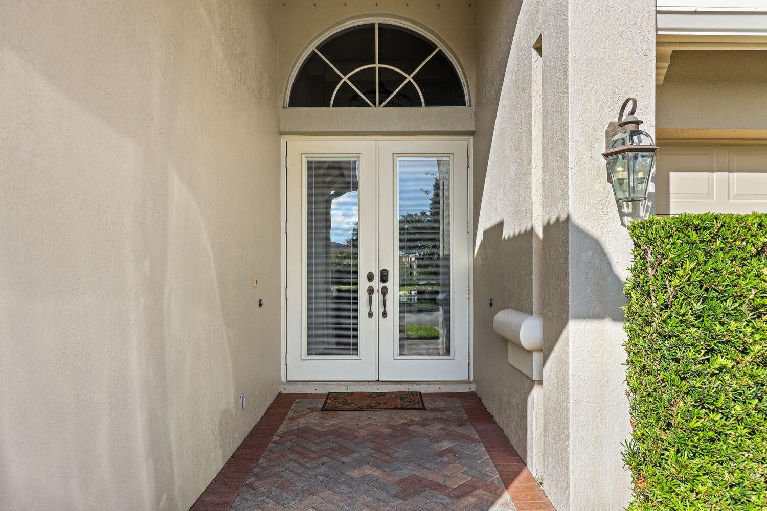 9152 Short Chip Circle Port St. Lucie, FL 34986 - Photo 40 of 72 a view of front door of a house