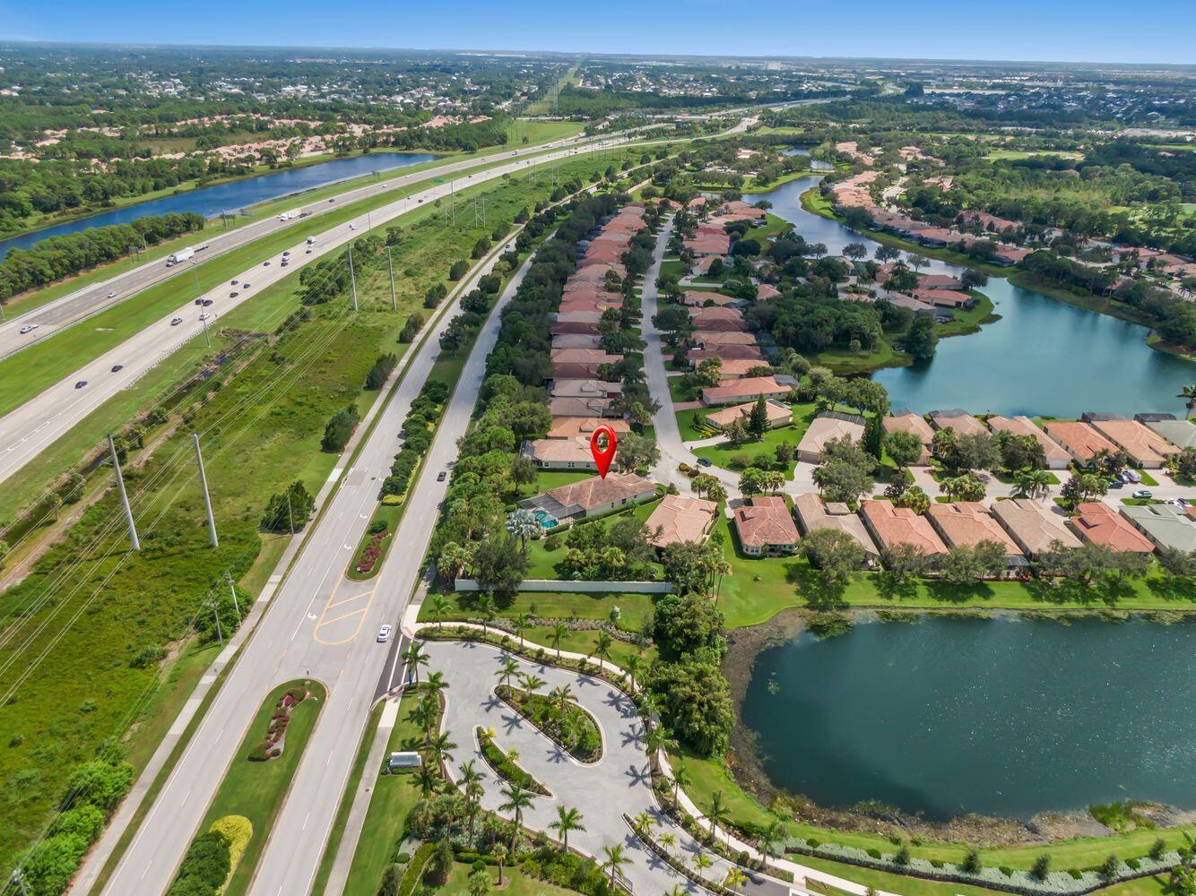 9152 Short Chip Circle Port St. Lucie, FL 34986 - Photo 4 of 72 an aerial view of lake residential house with outdoor space