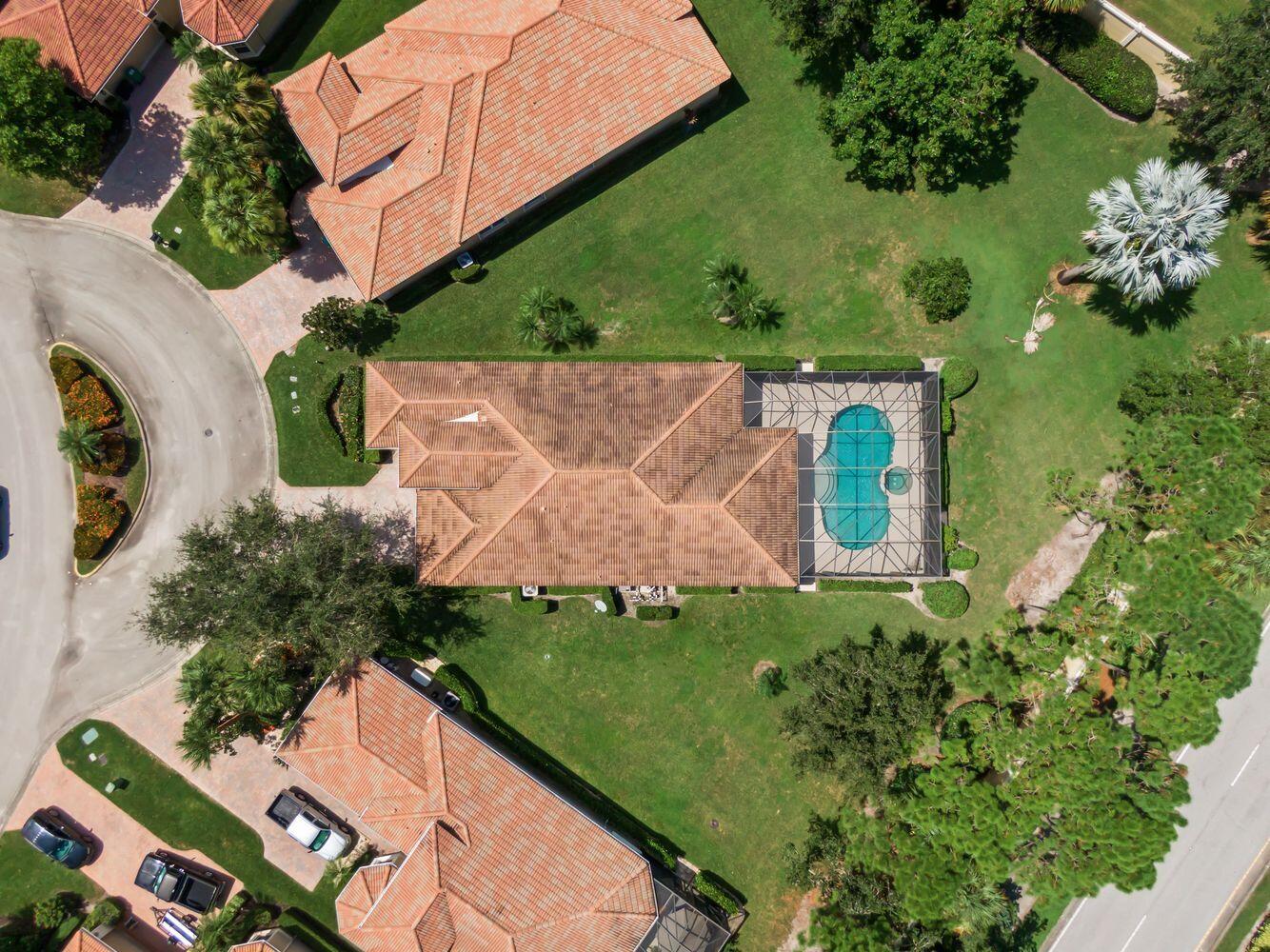 9152 Short Chip Circle Port St. Lucie, FL 34986 - Photo 44 of 72 an aerial view of a house with a garden