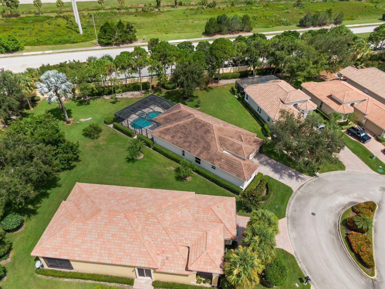 9152 Short Chip Circle Port St. Lucie, FL 34986 - Photo 47 of 72 an aerial view of a house with a garden