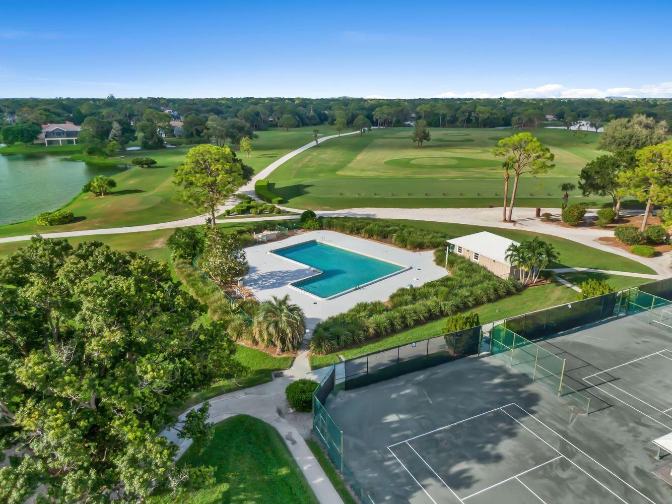 9152 Short Chip Circle Port St. Lucie, FL 34986 - Photo 64 of 72 a view of a garden with a lake