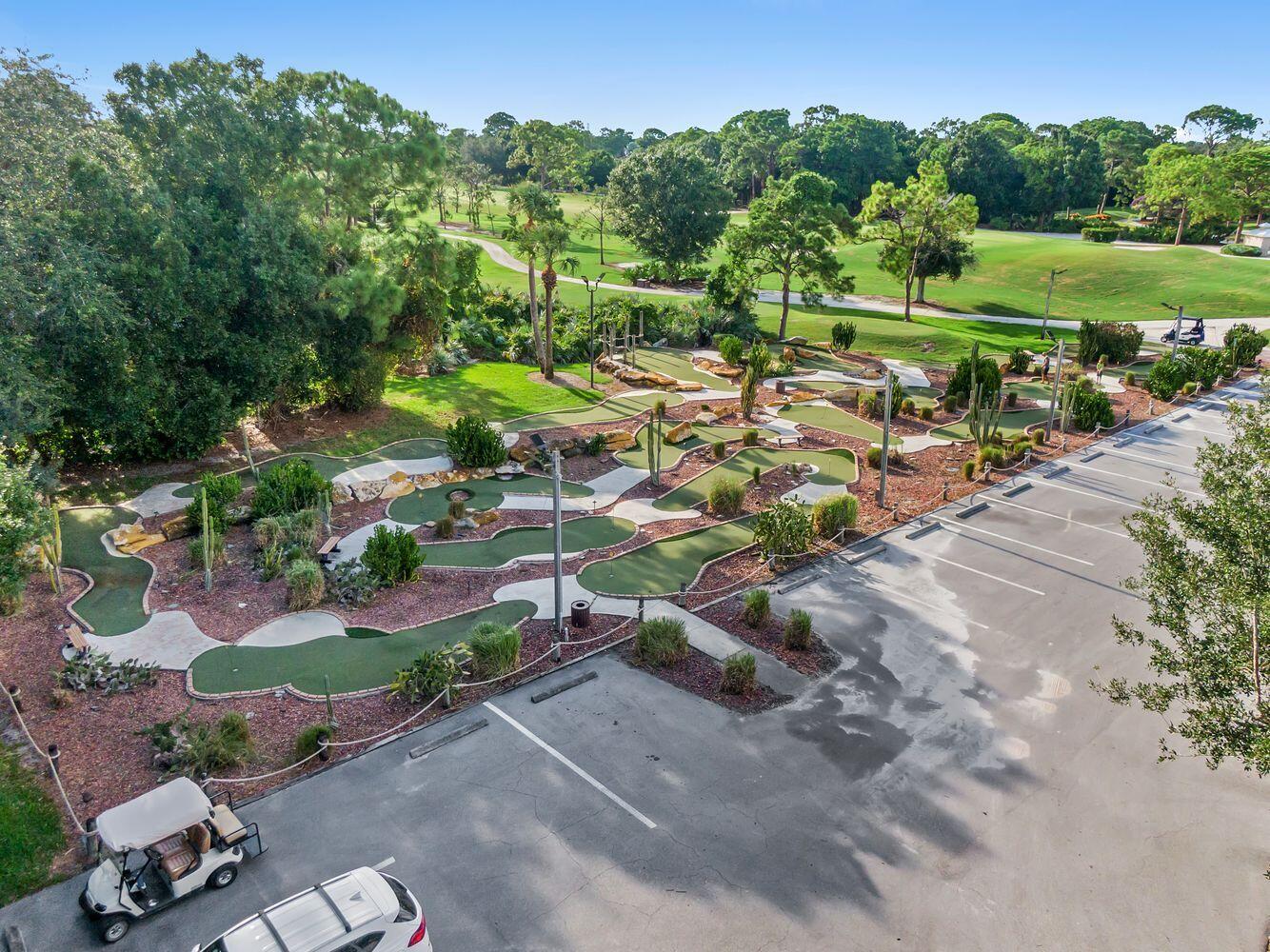 9152 Short Chip Circle Port St. Lucie, FL 34986 - Photo 69 of 72 an aerial view of a house with a yard and lake view
