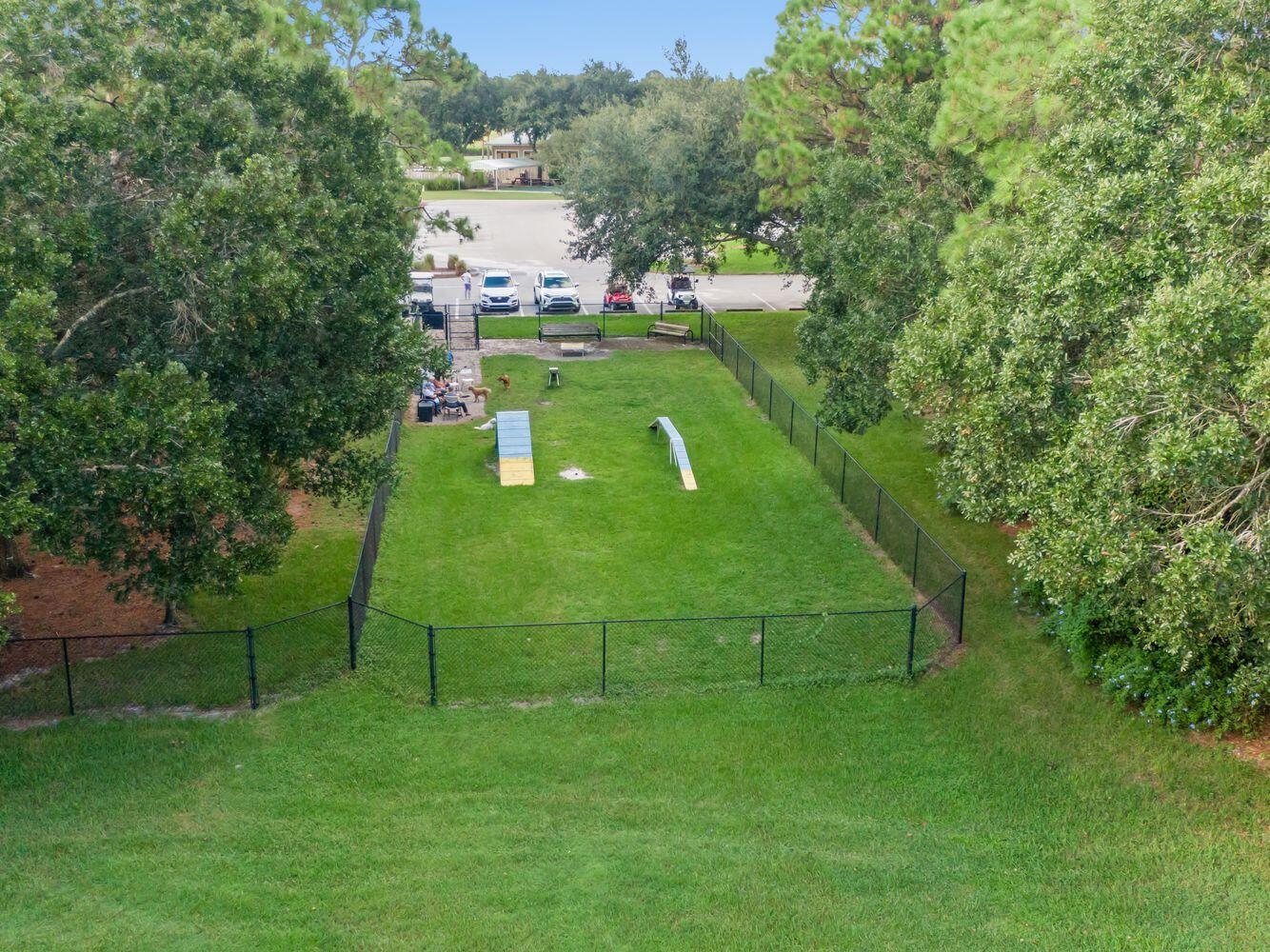 9152 Short Chip Circle Port St. Lucie, FL 34986 - Photo 71 of 72 a green field with lots of trees in it