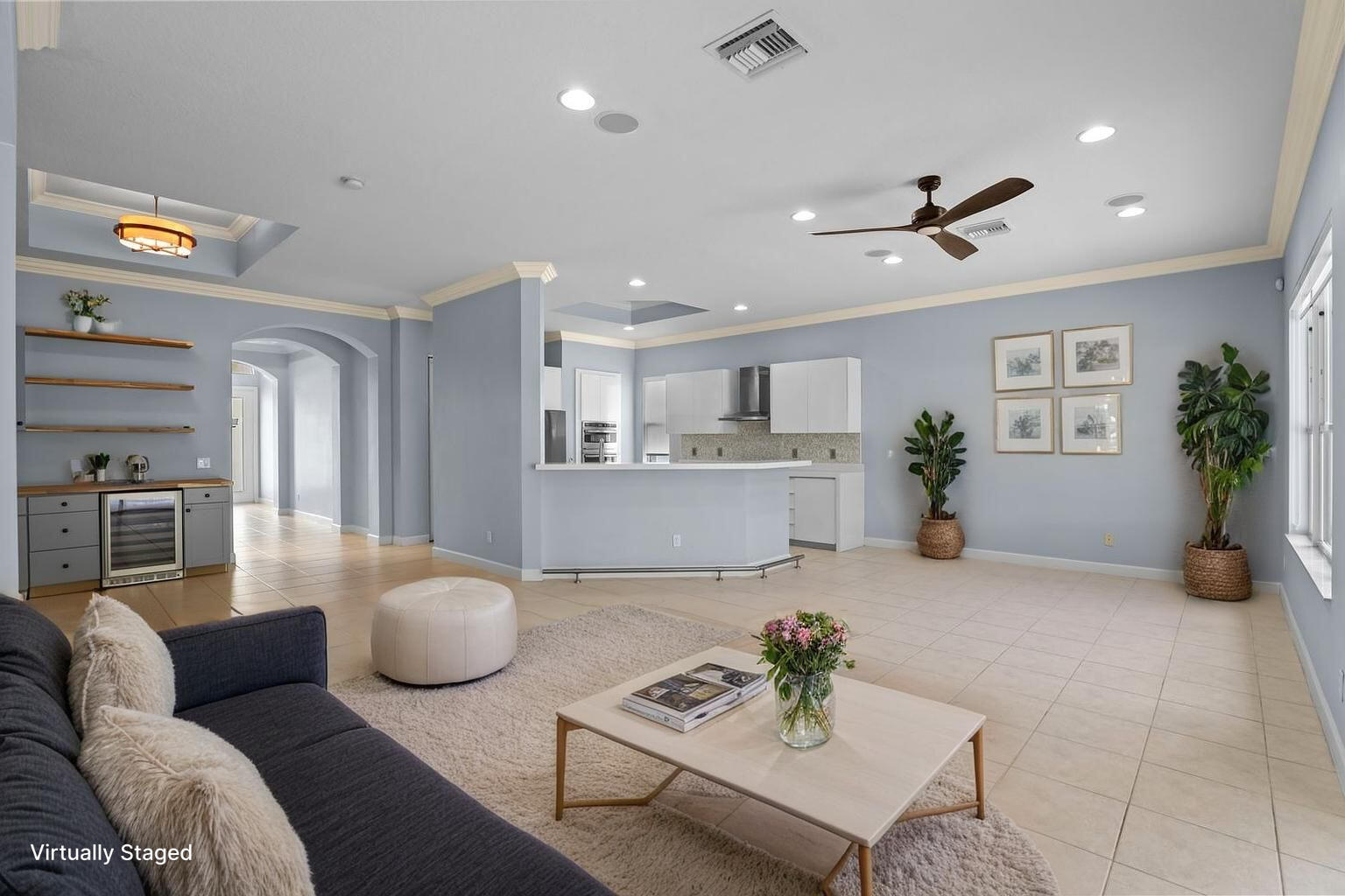 9152 Short Chip Circle Port St. Lucie, FL 34986 - Photo 9 of 72 a living room with furniture and a view of kitchen