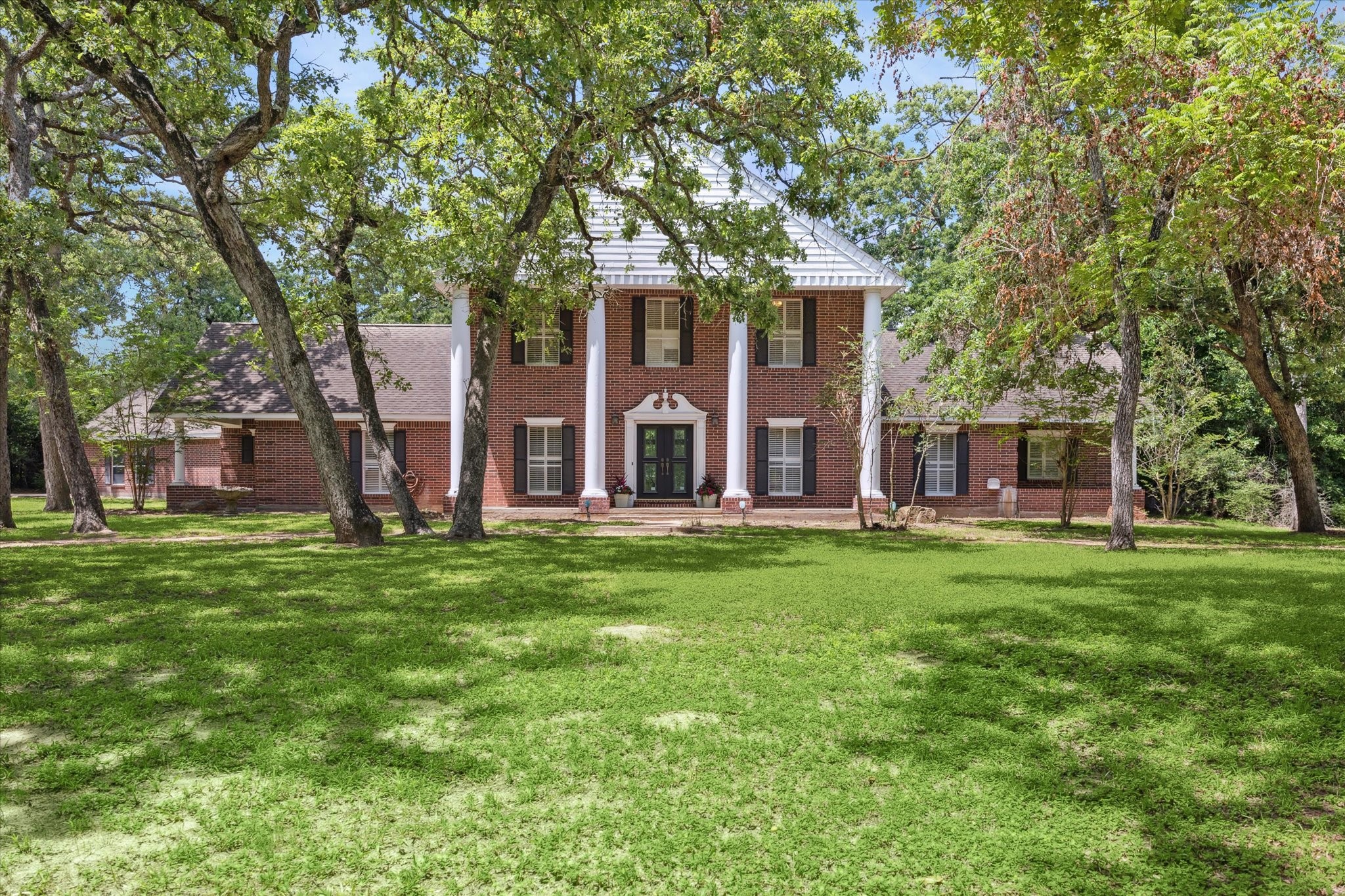 491 Oak Forest Road Bellville, TX 77418 - Photo 1 of 33 front view of a house with a yard