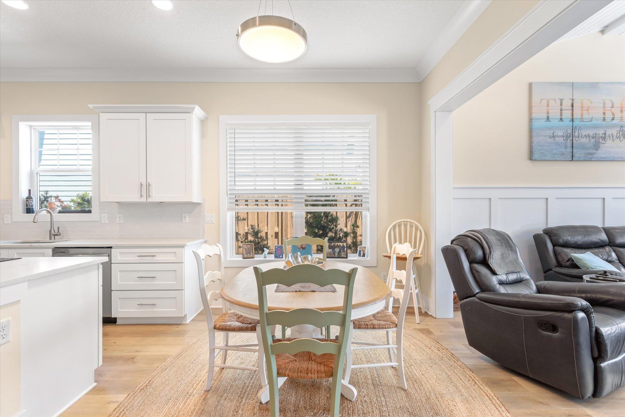 125 5th Street St. Augustine, FL 32080 - Photo 11 of 51 a dining room with furniture and a large window