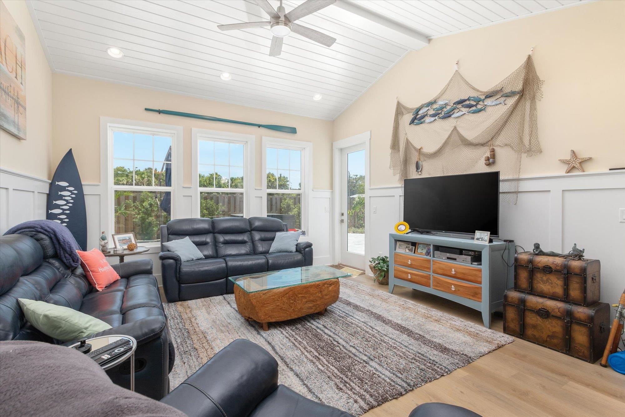 125 5th Street St. Augustine, FL 32080 - Photo 13 of 51 a living room with furniture and a flat screen tv